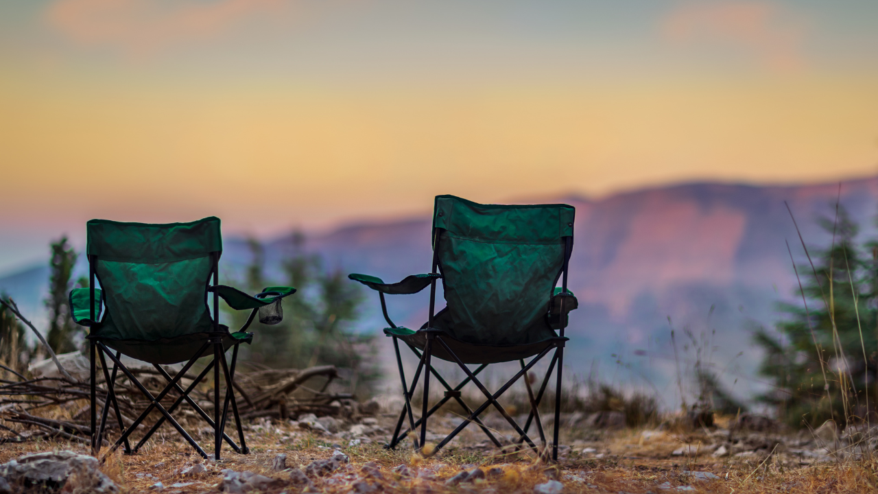 Peaceful campground chairs overlooking a quiet mountain landscape at sunset, reflecting themes of mindfulness, presence, and finding peace without perfection.